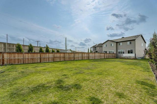 340 Quigley Drive, Home with 4 bedrooms, 3 bathrooms and 2 parking in Cochrane AB | Image 36