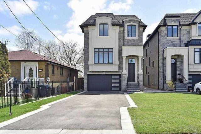95 Falstaff Ave, House detached with 4 bedrooms, 5 bathrooms and 6 parking in Toronto ON | Image 1