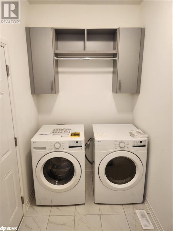 main floor laundry with entry in to garage | Image 20