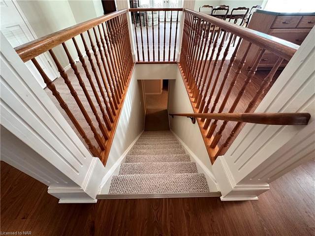 The stairs leading down to the finished basement. | Image 21