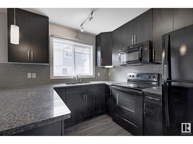 100 - 9535 217 St Nw, House attached with 3 bedrooms, 2 bathrooms and null parking in Edmonton AB | Image 14