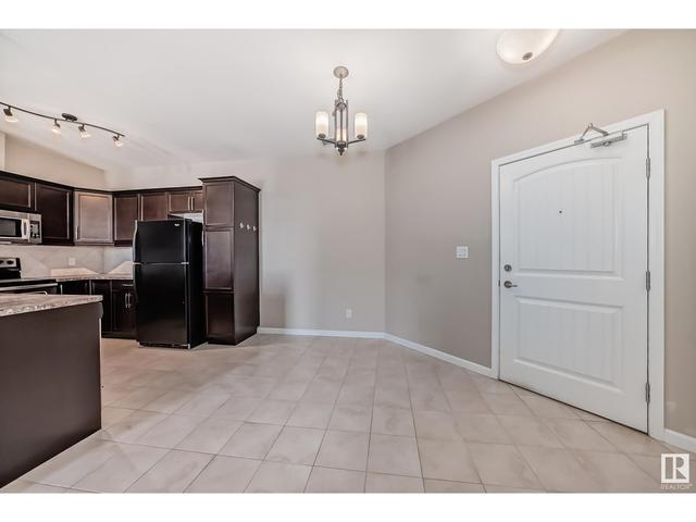 310 - 6083 Maynard Wy Nw, Condo with 1 bedrooms, 1 bathrooms and 2 parking in Edmonton AB | Image 5