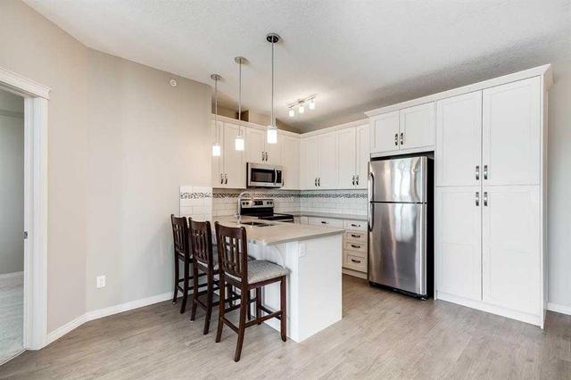 1407 - 522 Cranford Drive Se, Condo with 2 bedrooms, 2 bathrooms and 1 parking in Calgary AB | Image 4