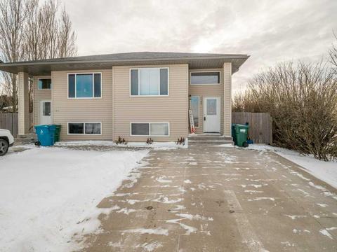 1102 44 Avenue N, Home with 3 bedrooms, 1 bathrooms and 3 parking in Lethbridge AB | Card Image