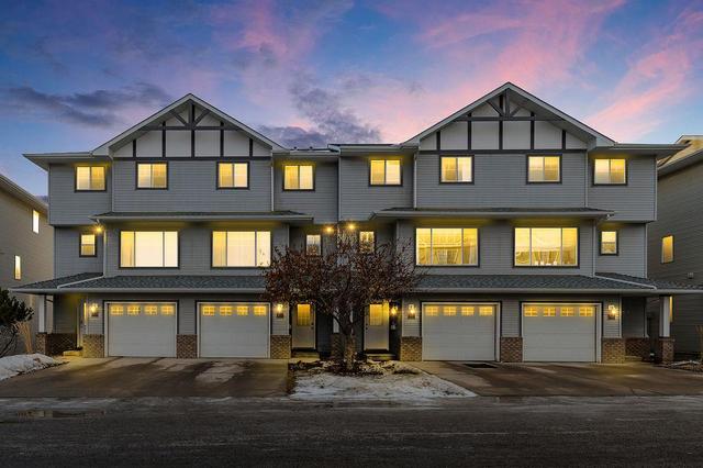 12 Crystal Shores Cove, Home with 2 bedrooms, 2 bathrooms and 2 parking in Calgary AB | Image 8