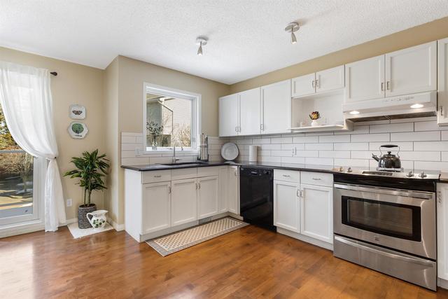 18 Stradwick Rise Sw, Home with 4 bedrooms, 2 bathrooms and 4 parking in Calgary AB | Image 18