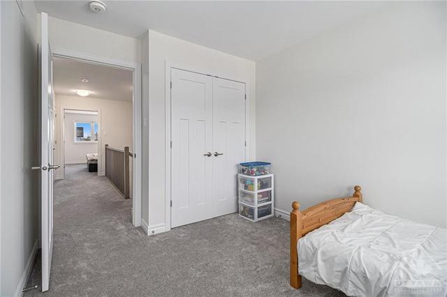 Bedroom three also features dual windows and a roomy closet, enhancing natural light & storage convenience. | Image 16