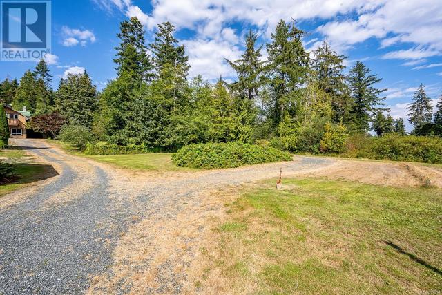 8185 Island Hwy S, House detached with 4 bedrooms, 4 bathrooms and 6 parking in Comox Valley A BC | Image 21