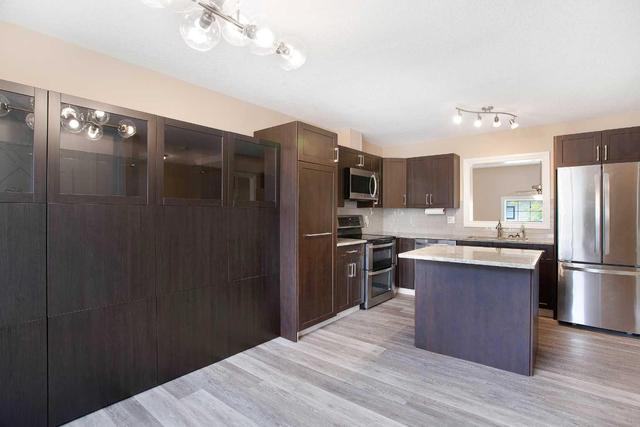 71 Cougar Ridge Mews Sw, Home with 2 bedrooms, 1 bathrooms and 2 parking in Calgary AB | Image 14