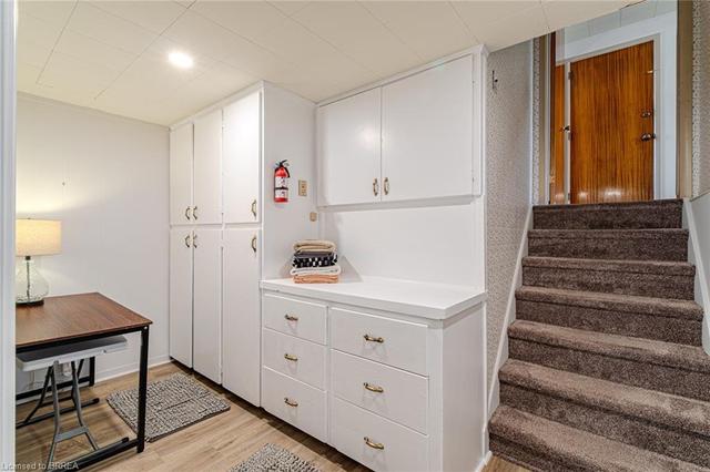 Extra storage and a great folding area off of the laundry room on the lower level. Could also be used as an arts and crafts area | Image 19