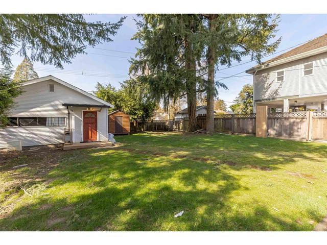 7045 142 Street, House detached with 5 bedrooms, 3 bathrooms and 3 parking in Surrey BC | Image 33