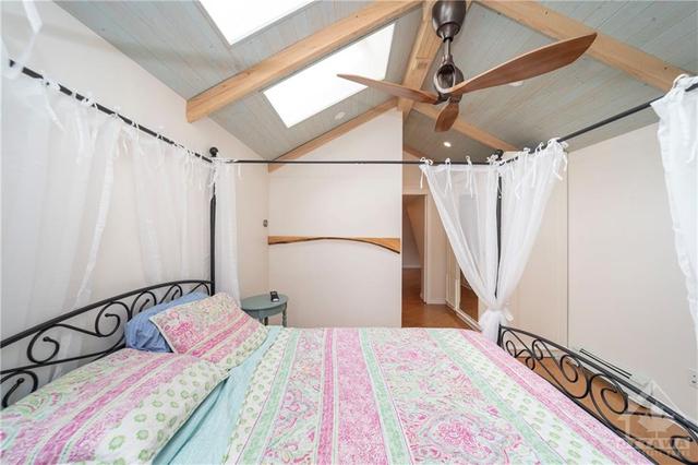 Wood beams and Skylight in Primary Bedroom | Image 16