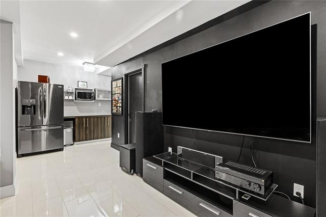 Snack area with granite countertop and microwave shelf | Image 17