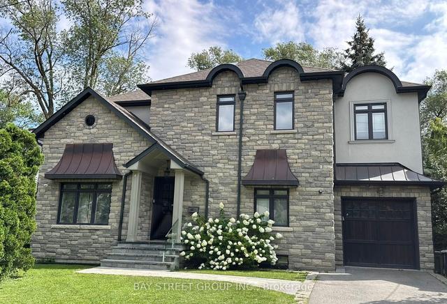 128 Thompson Ave, House detached with 3 bedrooms, 5 bathrooms and 3 parking in Toronto ON | Image 1