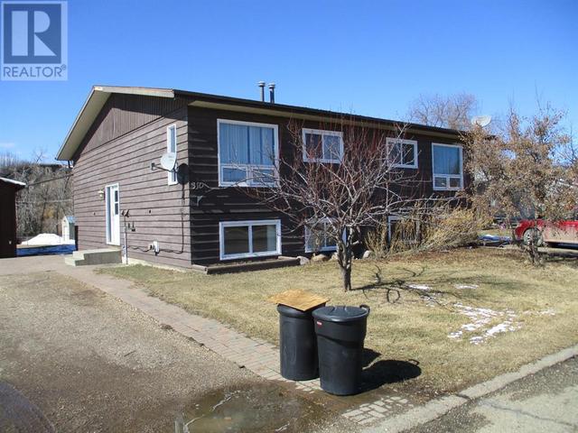 310 2nd Street Sw, House semidetached with 4 bedrooms, 2 bathrooms and 4 parking in Manning AB | Image 14