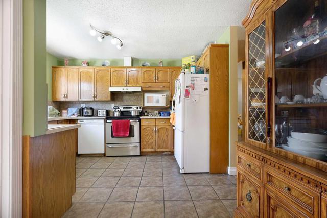412 4 Street W, House detached with 4 bedrooms, 2 bathrooms and 3 parking in Brooks AB | Image 11