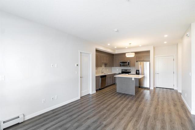 208 - 30 Shawnee Common Sw, Condo with 2 bedrooms, 2 bathrooms and 1 parking in Calgary AB | Image 10
