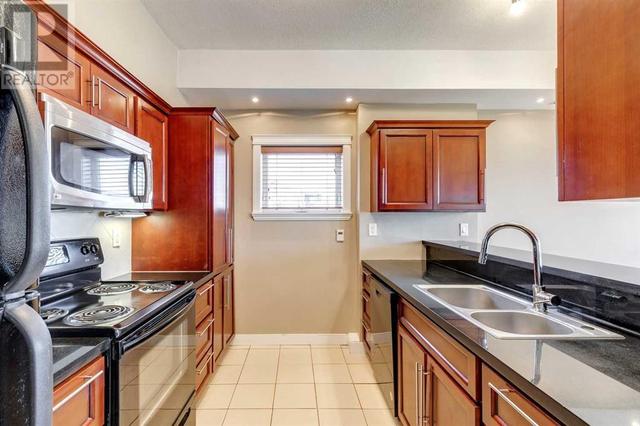 31, - 209 17 Avenue Ne, Condo with 3 bedrooms, 2 bathrooms and 1 parking in Calgary AB | Image 11