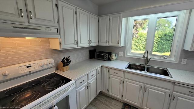 Updated Kitchen with tons of cabinets, pantry and access to the rear yard | Image 5
