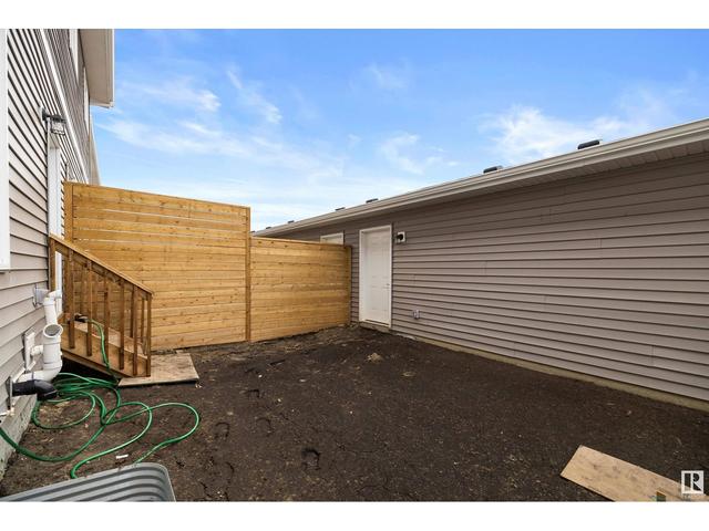 8515 96 Av, House attached with 3 bedrooms, 2 bathrooms and null parking in Morinville AB | Image 34
