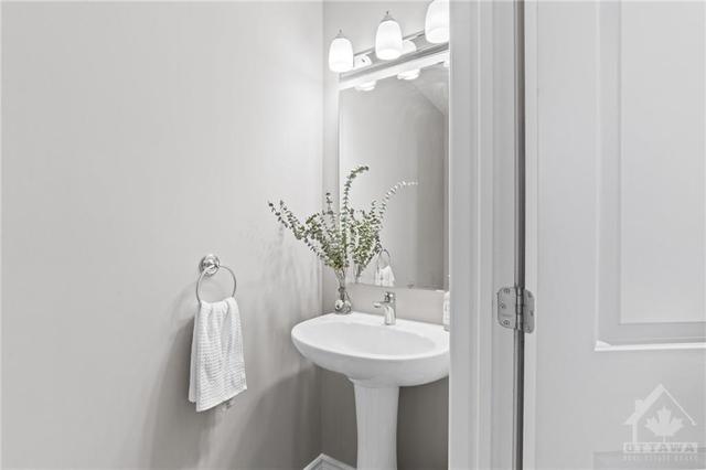 Powder room halfway up the steps for guests and easy access. | Image 8