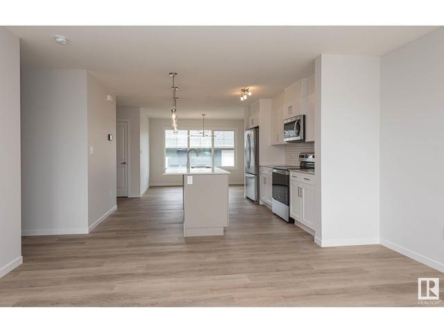 5702 Juchli Av Nw, House attached with 3 bedrooms, 3 bathrooms and null parking in Edmonton AB | Image 4