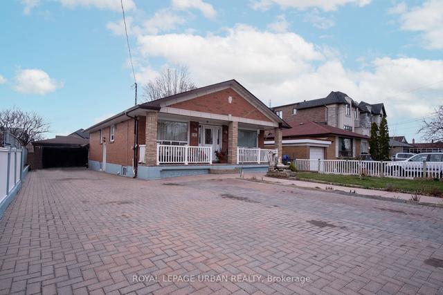 99 Falstaff Ave, House detached with 3 bedrooms, 2 bathrooms and 8 parking in Toronto ON | Image 1