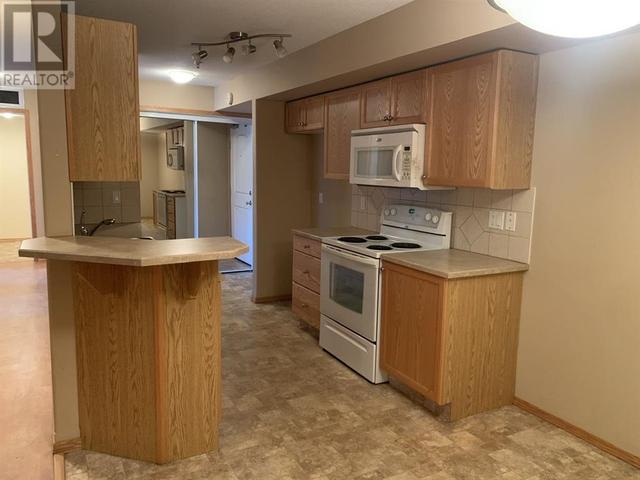 105, - 5205 Woodland Road, Condo with 2 bedrooms, 1 bathrooms and 1 parking in Innisfail AB | Image 2