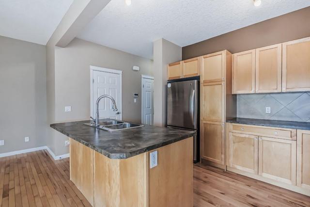 405 - 620 Luxstone Landing Sw, Home with 3 bedrooms, 2 bathrooms and 2 parking in Airdrie AB | Image 5