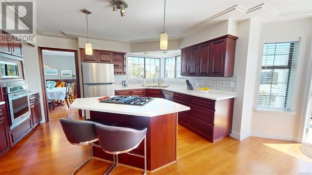 What a kitchen - opening to a deck, an island, quartz counters... beautiful | Image 11