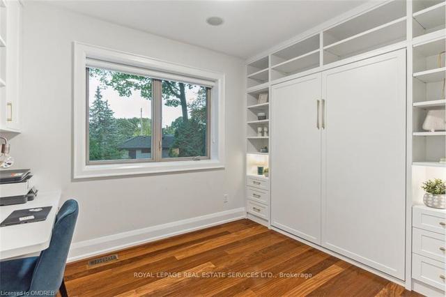 Main Floor Bedroom/Office with Murphy Bed Closed | Image 14