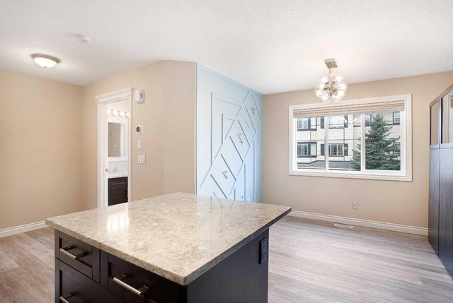71 Cougar Ridge Mews Sw, Home with 2 bedrooms, 1 bathrooms and 2 parking in Calgary AB | Image 12