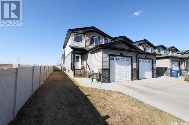 601 - 2 Savanna Crescent, House attached with 3 bedrooms, 4 bathrooms and null parking in Pilot Butte SK | Image 3