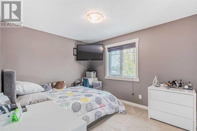 128 Mike Ralph Way Sw, House detached with 4 bedrooms, 3 bathrooms and 2 parking in Calgary AB | Image 35
