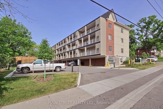 101 - 128 Barrie St, Condo with 2 bedrooms, 2 bathrooms and 2 parking in Bradford West Gwillimbury ON | Image 1