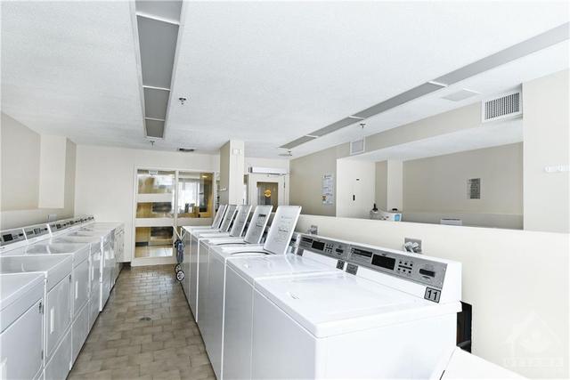 Common laundry on the main level in the building | Image 25