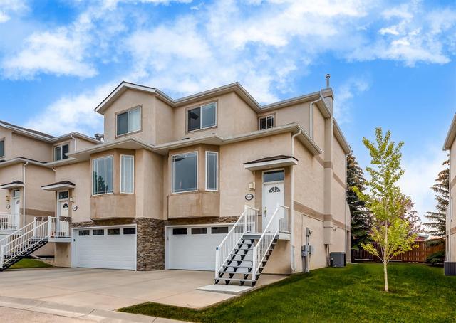109 Country Hills Gardens Nw, Home with 2 bedrooms, 2 bathrooms and 4 parking in Calgary AB | Image 1