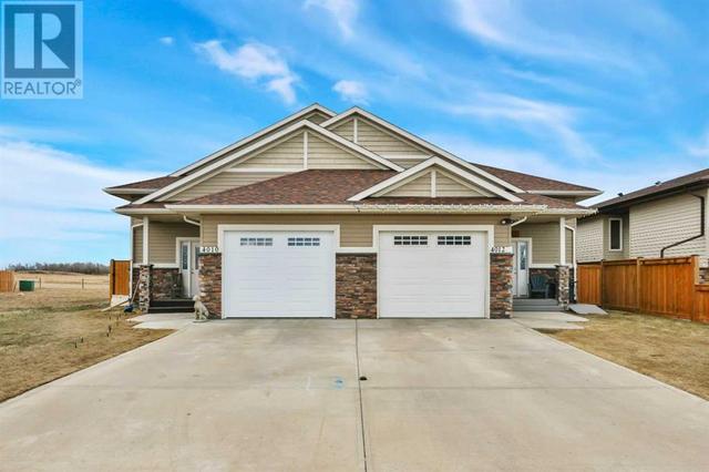 4012 68 Street, House semidetached with 4 bedrooms, 3 bathrooms and 2 parking in Stettler AB | Image 3