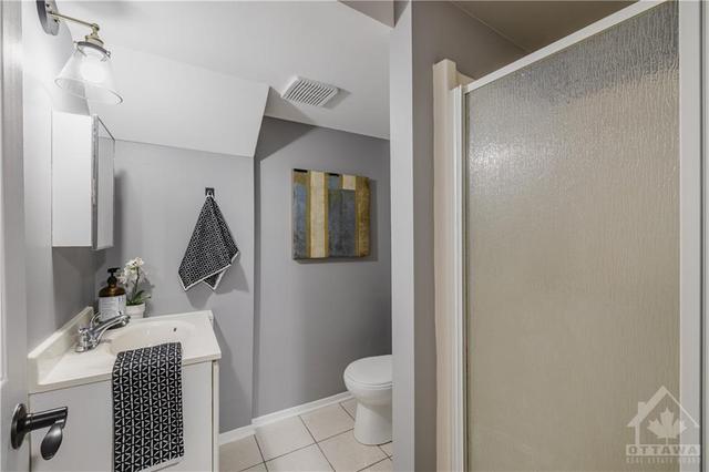 The addition of a third bathroom (with a shower) in the lower level adds much convenience. | Image 27