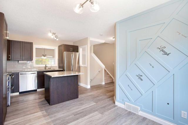 71 Cougar Ridge Mews Sw, Home with 2 bedrooms, 1 bathrooms and 2 parking in Calgary AB | Image 15