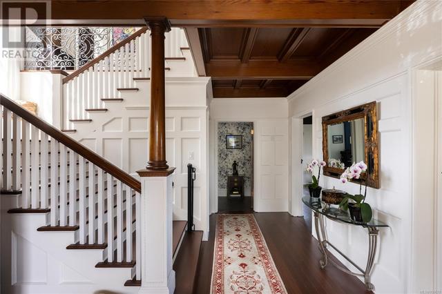 Grand staircase leading to 3 floors of living space | Image 6