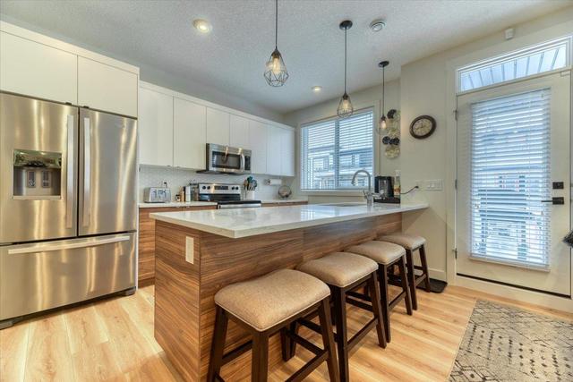 147 Savanna Walk Ne, Home with 3 bedrooms, 2 bathrooms and 2 parking in Calgary AB | Image 4
