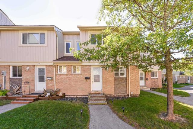 24 - 561 Childs Dr, Townhouse with 3 bedrooms, 2 bathrooms and 1 parking in Milton ON | Image 1