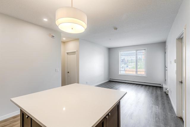 208 - 30 Shawnee Common Sw, Condo with 2 bedrooms, 2 bathrooms and 1 parking in Calgary AB | Image 6