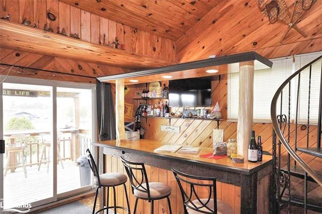 Main Cottage Bar with walkout to your Sun Filled deck | Image 2