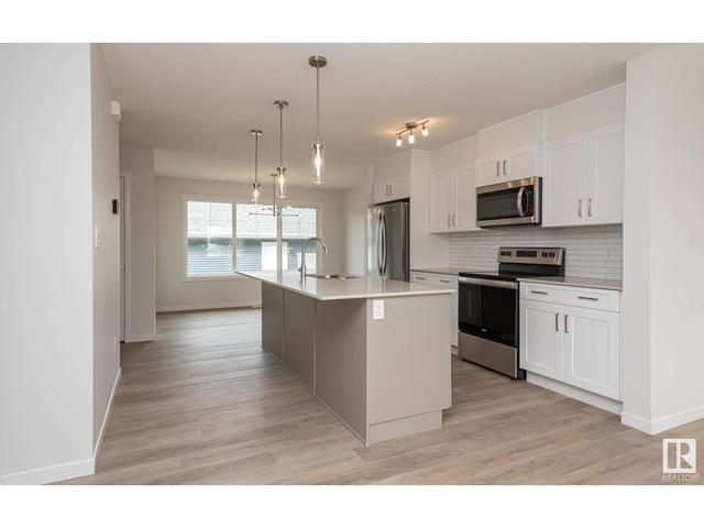 5702 Juchli Av Nw, House attached with 3 bedrooms, 3 bathrooms and null parking in Edmonton AB | Image 5