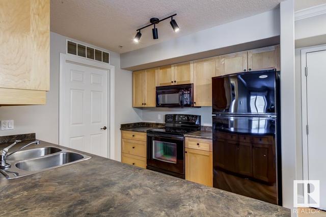 213 - 13111 140 Av Nw, Condo with 2 bedrooms, 2 bathrooms and 2 parking in Edmonton AB | Image 9