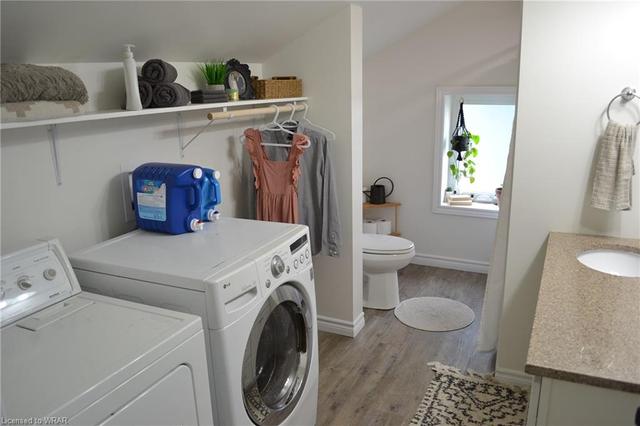 Upper floor combination laundry/4 piece bathroom. | Image 33
