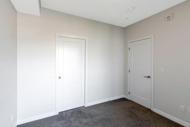 208 - 30 Shawnee Common Sw, Condo with 2 bedrooms, 2 bathrooms and 1 parking in Calgary AB | Image 14