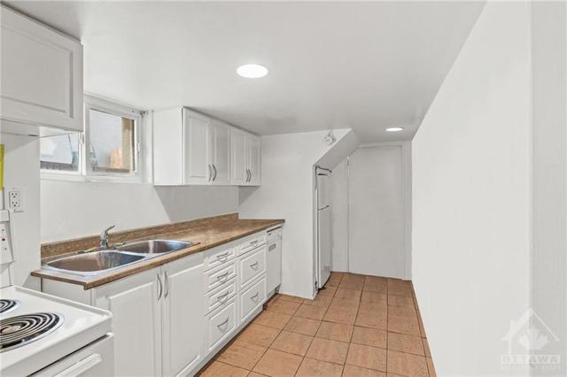 (Virtually Altered) Lower Level 1 Bedroom Apt- Tiled kitchen. | Image 19